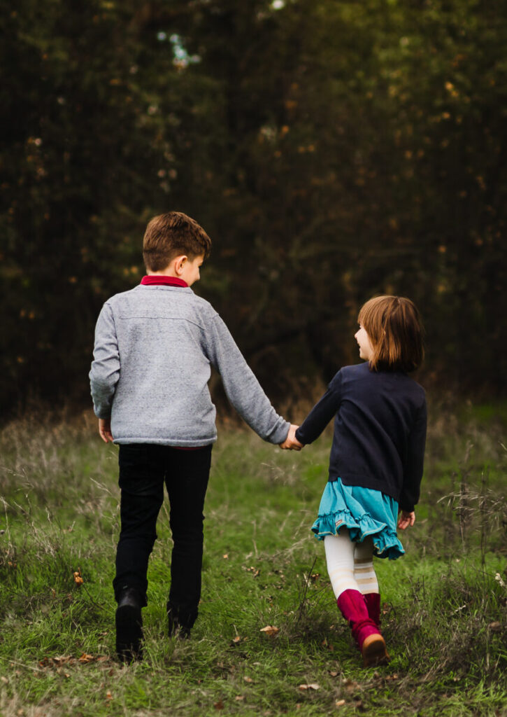 kids walking hand in hand